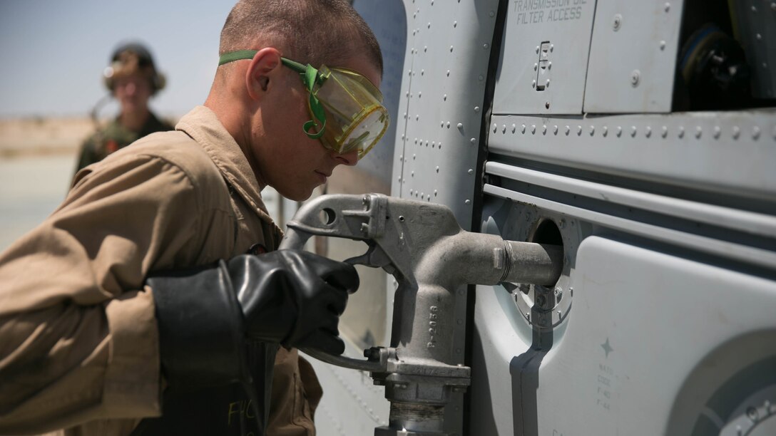 A Marine with Marine Wing Support Squadron 272, performs a cold refuel at the Strategic Expeditionary Landing Field at the Combat Center during Integrated Training Exercise 5-17, July 29, 2017. MWSS-272 is supporting the Aviation Combat Element of the ITX. The ACE conducts offensive, defensive, and all other air operations to support the MAGTF mission .