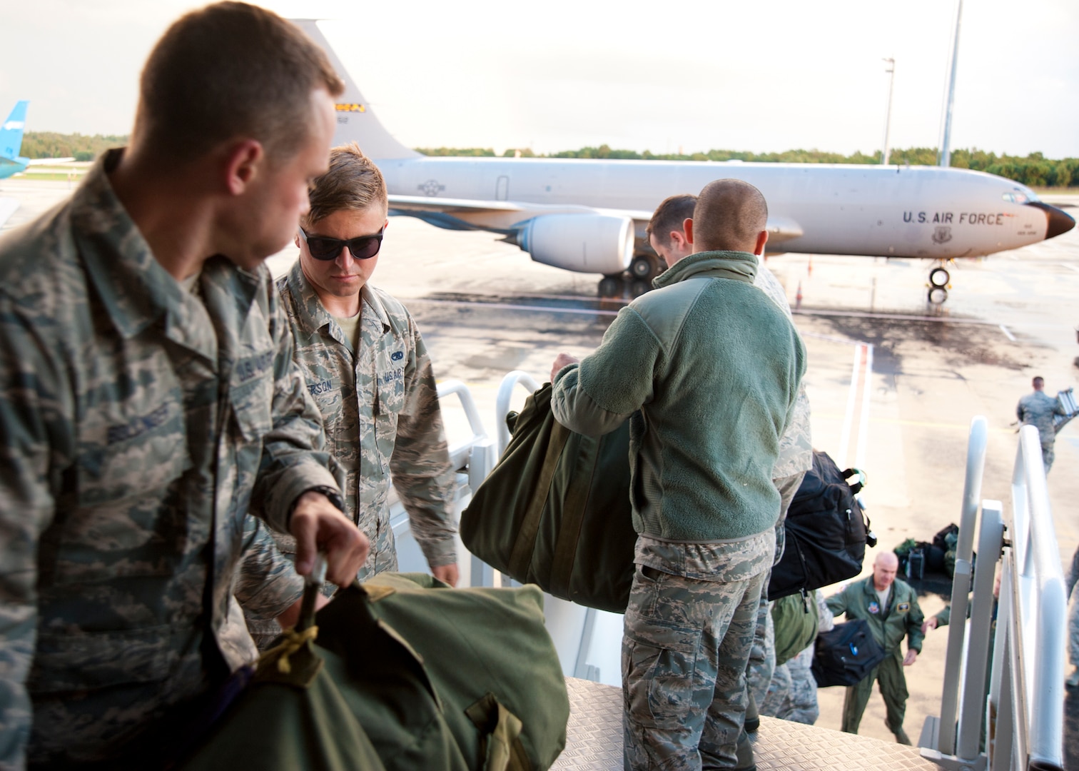 Passengers unload baggage from a 459th Air Refueling Wing KC-135R Stratotanker onto the Tallinn Airport, Estonia, flight line Aug. 5.