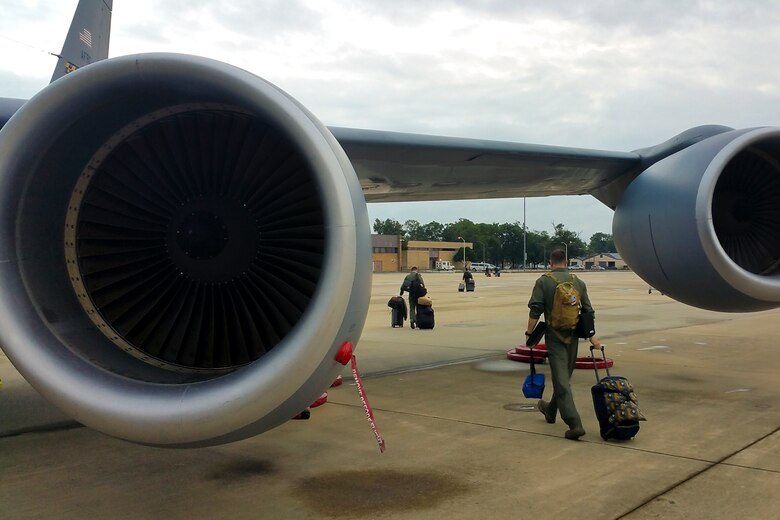 Crewmembers depart after returning home from Estonia.