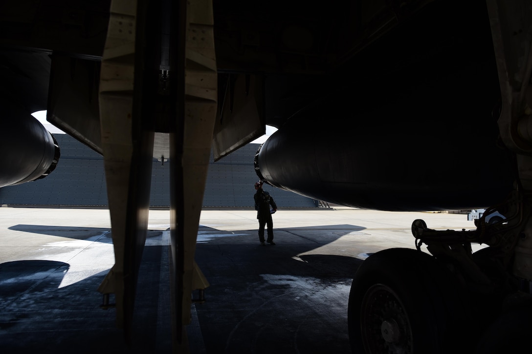 Col. Gentry W. Boswell, former 28th Bomb Wing commander, inspects a b-1 bomber before launch at Ellsworth Air Force Base