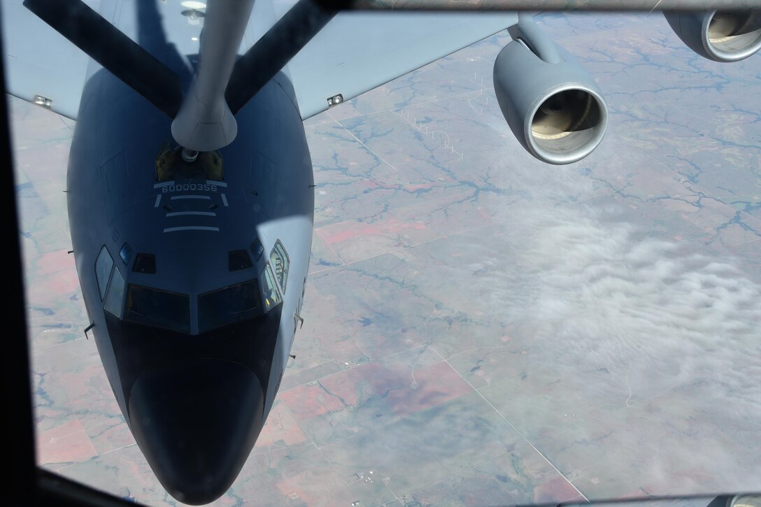 A KC-135 Stratotanker piloted by an 18th Air Refueling Squadron aircrew is refueled by another KC-135 from McConnell Aug. 5, 2017.  The KC-135 Stratotanker provides the core aerial refueling capability for the United States Air Force and has excelled in this role for 60 years. (U.S. Air Force photo by Tech. Sgt. Abigail Klein)