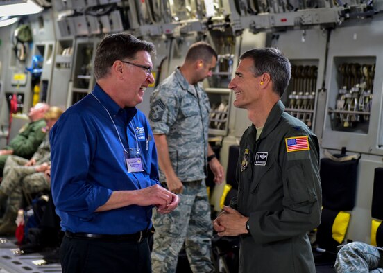 Col. Dan Sarachene, commander of the 910 AW, chats with Dr. Lance Grahn, dean at Kent State University's Trumbull Branch, while on a C-17 Globemaster III during a Civic Leader Tour July 27, 2017.