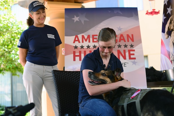 Staff Sgt. Amanda Cubbage, a 355th Security Forces Squadron member, reunites with her recently retired military working dog, Rick, in Tucson, Ariz., Aug. 8, 2017. Cubbage worked with Rick while she served as a MWD handler at Osan Air Base, South Korea. (U.S. Air Force photo/Airman 1st Class Michael X. Beyer)