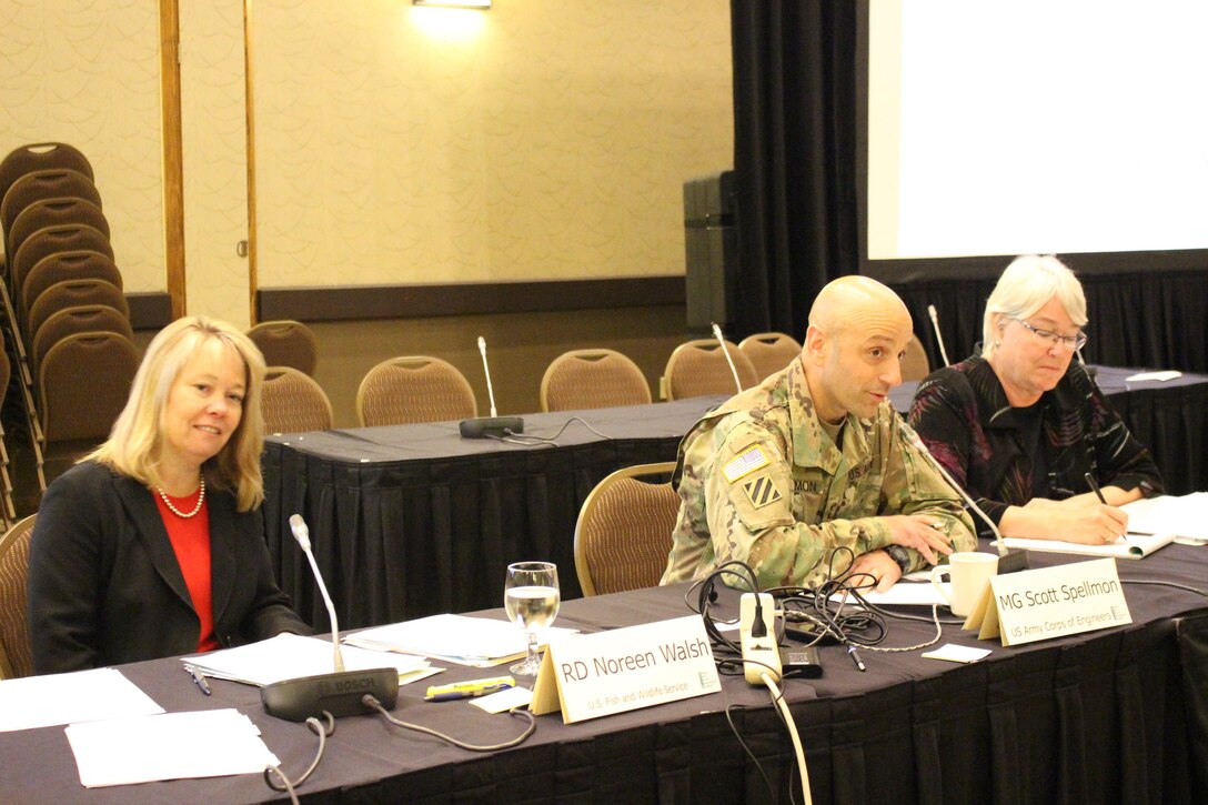 Noreen Walsh, Regional Director, Mountain-Prairie Region, U.S. Fish & Wildlife Service (left), Maj. Gen. Scott A. Spellmon, Commander, Northwestern Division, U.S. Army Corps of Engineers (center), and MRRIC Chair Gail Bingham (right) seated at a table.
