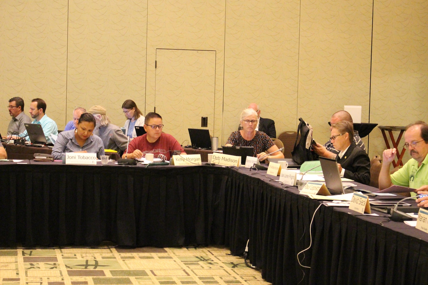 Tribal members of MRRIC seated at a table.