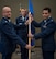 Lt. Col. Wayne Johnson, deputy commander for the 932nd Mission Support Group hands over command of the Logistic Readiness Flight to 1st. Lt. James Harbison Aug. 5, 2017, Scott Air Force Base, Illinois during a change of command ceremony. (U.S. Air Force photo by Tech. Sgt. Christopher Parr)