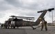 Japan Ground Self-Defense Force members assigned to the 102nd Aviation, at Camp Kizarazu, work together to move a UH-60JA helicopter during a C-17 load engagement, August 4, 2017, at Yokota Air Base, Japan. The training highlighted Yokota’s bilateral support and interoperability with the JGSDF. (U.S. Air Force photo by Airman 1st Class Juan Torres)