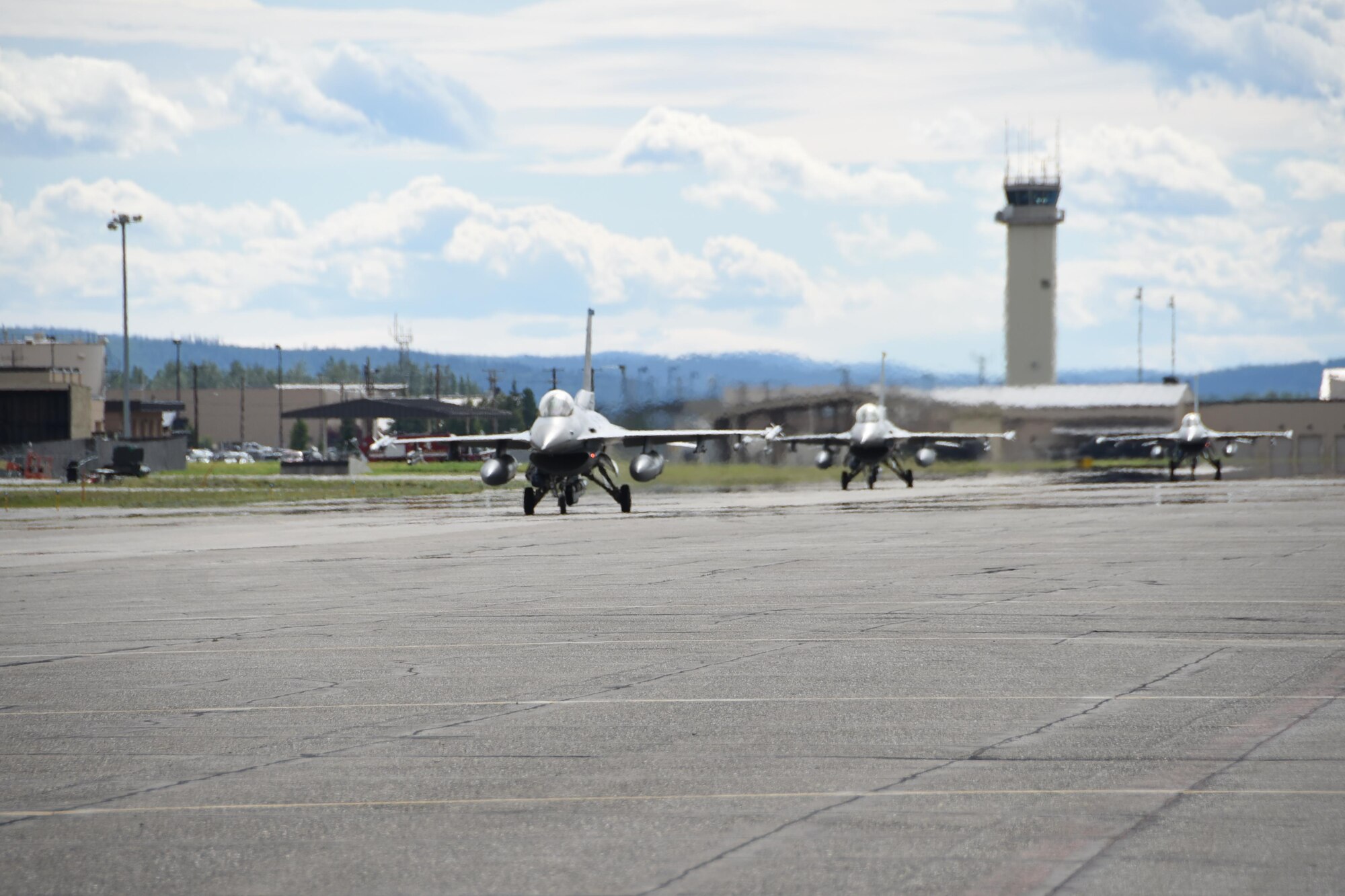 Three U.S. Air Force F-16 Fighting Falcons assigned to Kunsan Air Base, Republic of Korea, prepare to take-off from the runway during Red Flag-Alaska at Eielson Air Force Base, Alaska, Aug. 2, 2017. RF-A is a training exercise that provides joint offensive counter-air, interdiction, close air support and large force employment training in a simulated combat environment. (U.S. Air Force photo by Staff Sgt. Joshua Rosales)