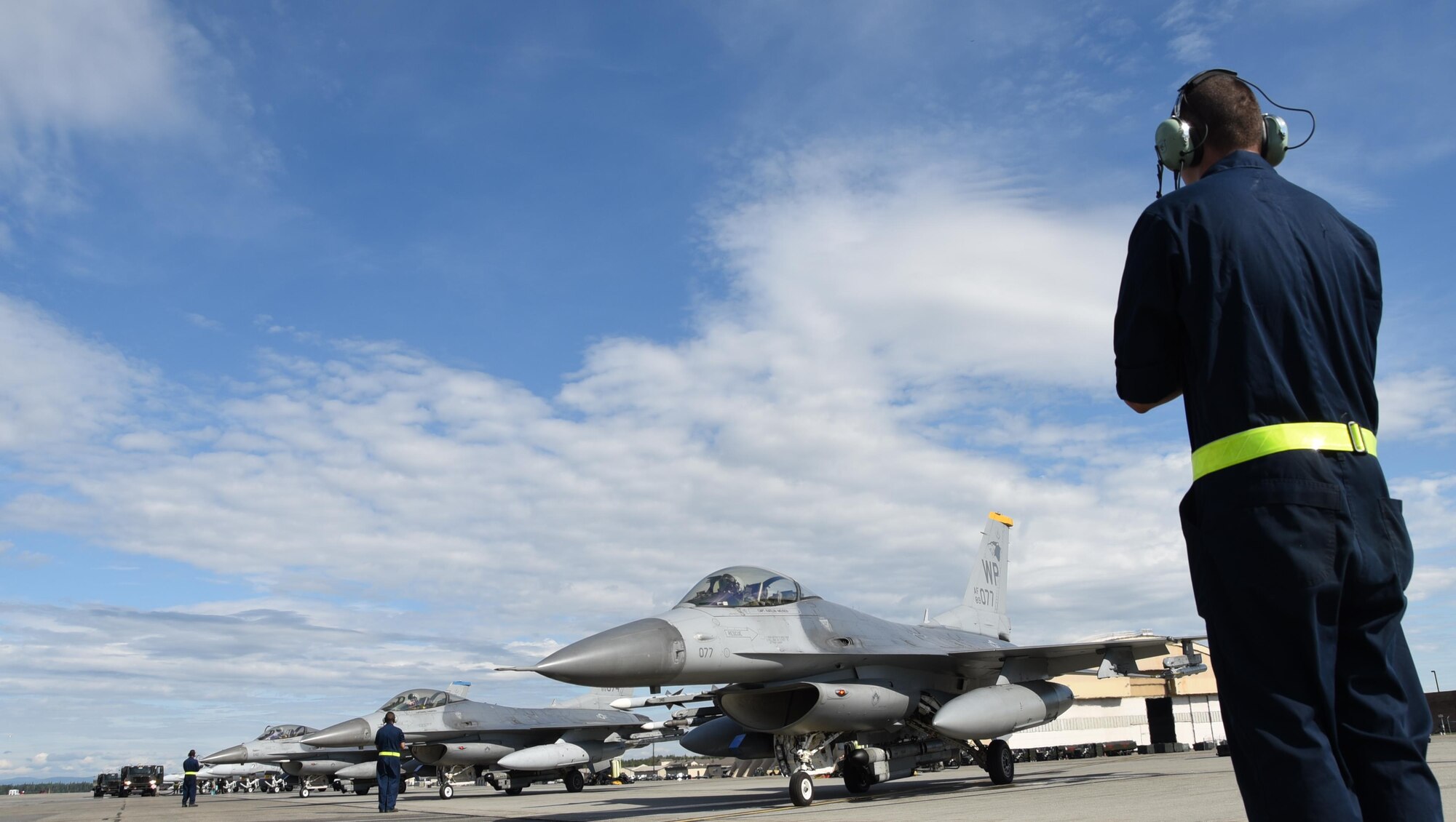 U.S. Air Force Airmen assigned to Kunsan Air Base, Republic of Korea, prepare F-16 Fighting Falcons for take-off during Red Flag-Alaska at Eielson Air Force Base, Alaska, Aug. 1, 2017. RF-A is a training exercise that provides joint offensive counter-air, interdiction, close air support and large force employment training in a simulated combat environment. (U.S. Air Force photo by Staff Sgt. Joshua Rosales)