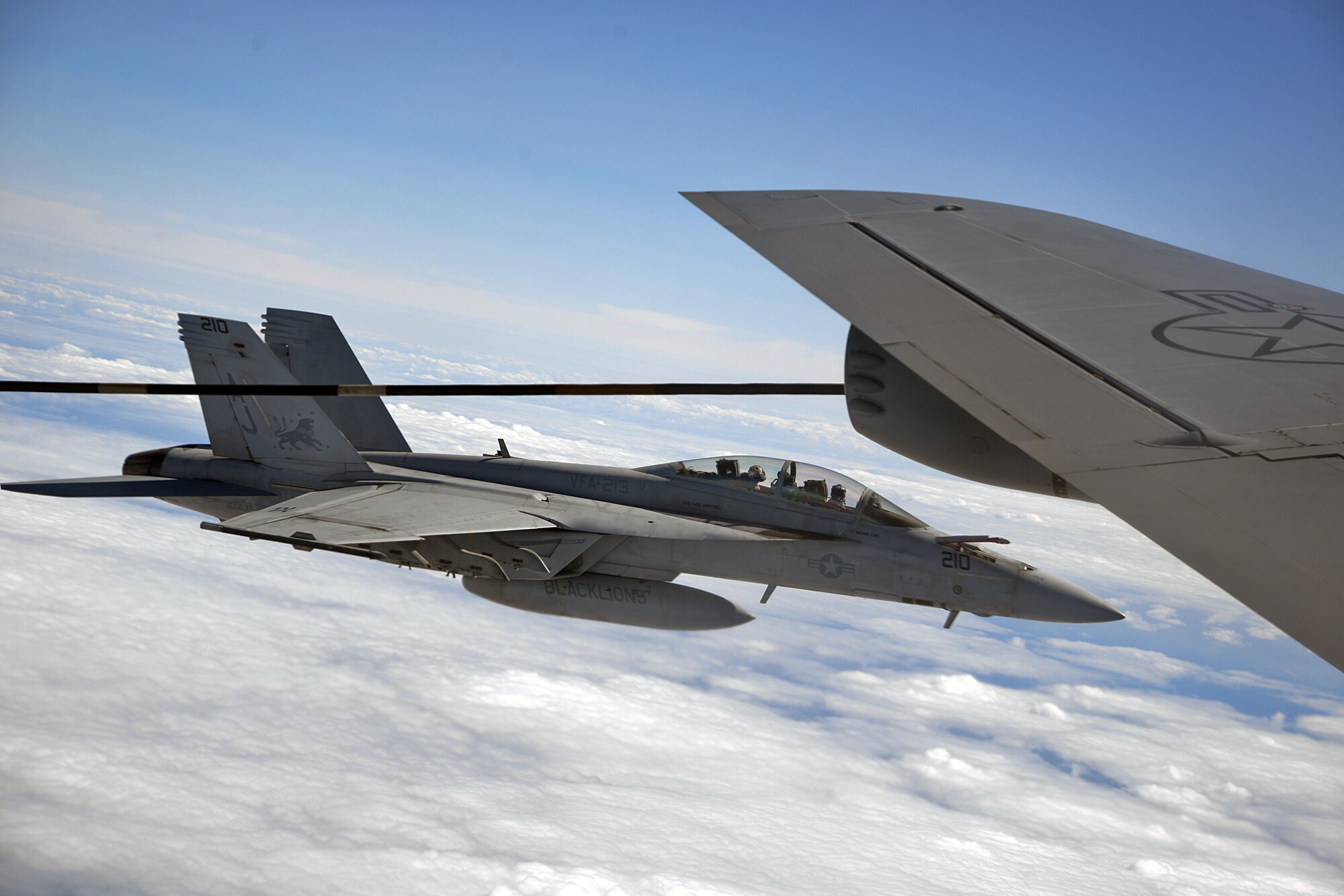 A U.S. Navy F/A 18F Super Hornet, attached to the “Blacklions” of Strike Fighter Squadron (VFA) 213 flies alongside a U.S. Air Force KC-135 Stratotanker from Royal Air Force Mildenhall off the coast of Scotland during exercise Saxon Warrior 2017, Aug. 9.
