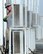 Senior Airman Thomas, 380th Expeditionary Civil Engineer Squadron heating, ventilation, and air conditioning technician, washes air conditioner condenser coils August 8, 2017, at Al Dhafra Air Base, United Arab Emirates. Condenser coils are meant to disperse heat outdoors, and get covered with dust several times faster here than stateside. (U.S. Air Force photo by Senior Airman Preston Webb)