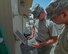 Staff Sgt. Zachery, left, and Senior Airman Timothy, both 380th Expeditionary Civil Engineer Squadron heating, ventilation, and air conditioning technicians, examine a wiring diagram August 8, 2017, at Al Dhafra Air Base, United Arab Emirates. Blown fuses account for a large amount of electrical equipment malfunctions. (U.S. Air Force photo by Senior Airman Preston Webb)