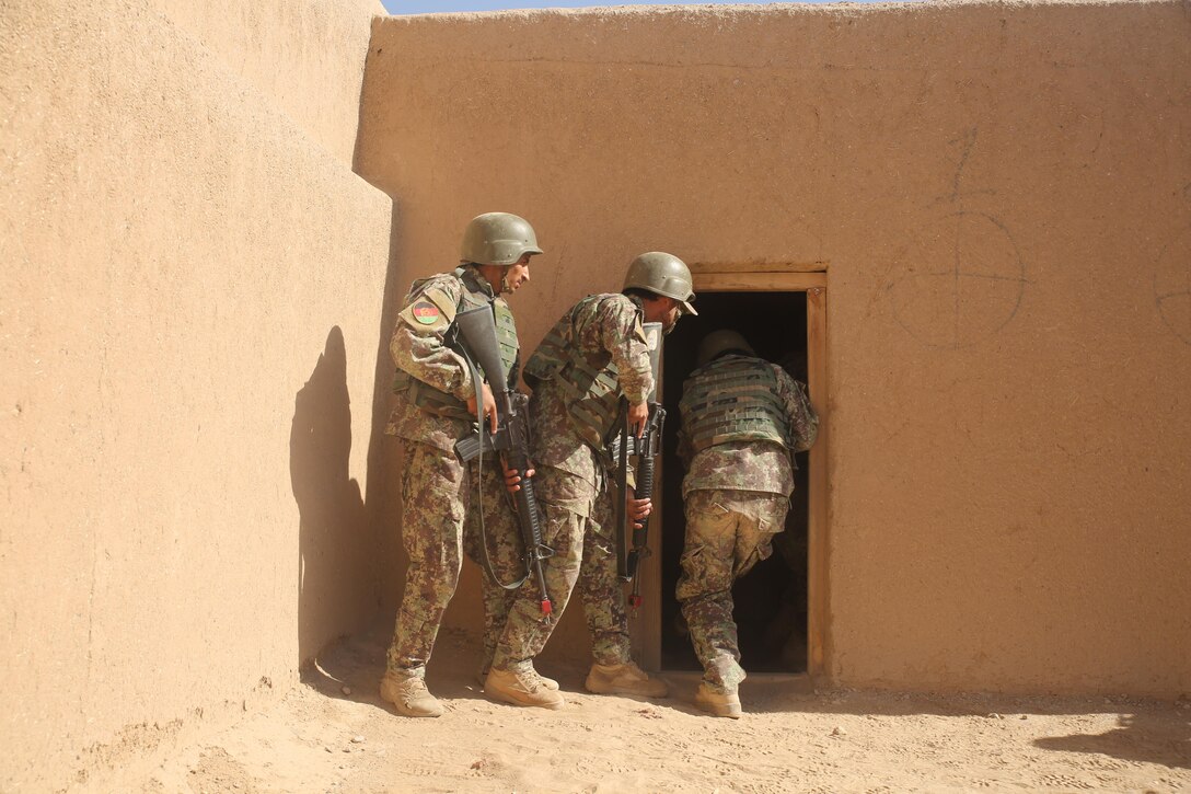 Afghan National Army soldiers with 2nd Brigade, 4th Kandak, 215th Corps conduct simulated room clearing procedures at Camp Shorabak, Afghanistan, June 12, 2017. This training aided them in a real-life operational environment during Maiwand 4. (U.S. Marine Corps photo by Sgt. Lucas Hopkins)