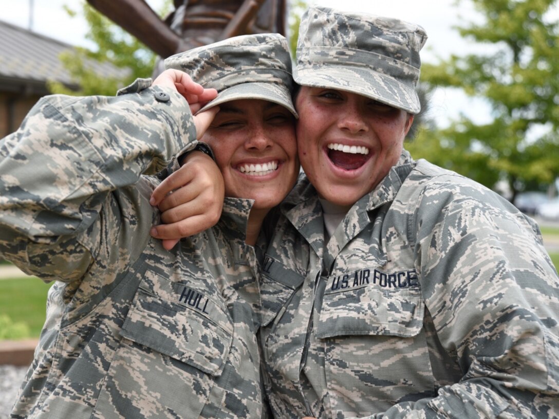 Lakota Hull, left, and Raven Hull pose for a photo at the 179th Airlift Wing in Mansfield, Ohio, July 25, 2017. Raven and Lakota are identical twins who are both serving in the Air Force National Guard. Air Force photo by Airman 1st Class Christi Richter
