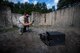 U.S. Air Force Senior Airman James Boyce, 86th Civil Engineer Squadron Explosive Ordnance Disposal journeyman, takes a photo of a breached safe with his phone at the EOD training range on Ramstein Air Base, Germany, Aug. 9, 2017. Boyce and his fellow technicians created charges out of C-4 to cut holes through the metal. (U.S. Air Force photo by Senior Airman Devin Boyer)