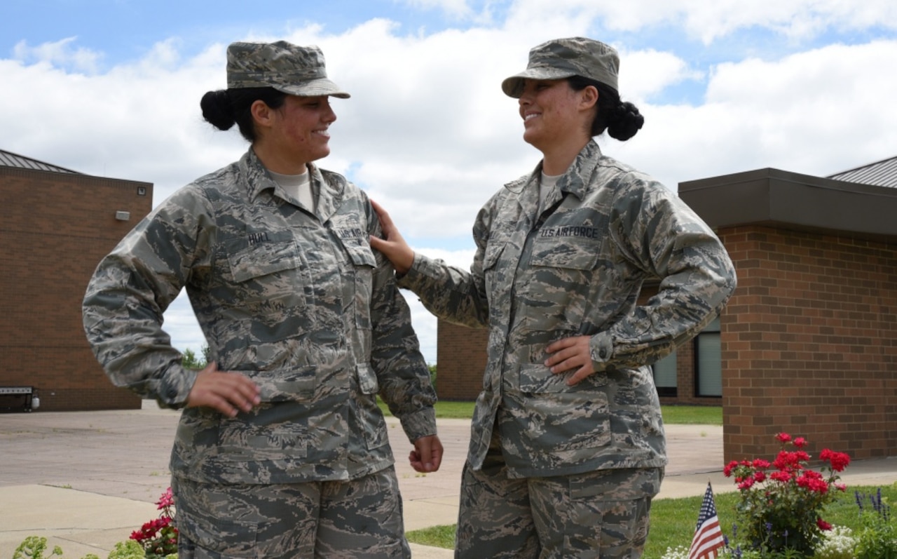 Lakota Hull, left, and Raven Hull pose for a photo at the 179th Airlift Wing in Mansfield, Ohio, July 25, 2017. Lakota and Raven are identical twins who enlisted in the Air Force National Guard together. Air Force photo by Airman 1st Class Christi Richter
