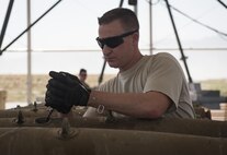 Tech. Sgt. Chris Brunsman, 455th Expeditionary Maintenance Squadron, installs an initiator into a general purpose bomb body at Bagram Airfield, Afghanistan, Aug. 4, 2017. Munitions systems Airmen are responsible for the accountability of everything from small arms ammunitions to large-scale guided bomb units. (U.S. Air Force photo by Staff Sgt. Benjamin Gonsier)