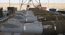 Munitions systems Airmen, commonly referred to as “AMMO,” conduct a bomb build at Bagram Airfield, Afghanistan, Aug. 4, 2017. AMMO Airmen are responsible for the accountability of everything from small arms ammunitions to large-scale guided bomb units. (U.S. Air Force photo by Staff Sgt. Benjamin Gonsier)