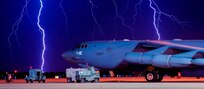 Lightning strikes behind a B-52H Stratofortress at Minot Air Force Base, N.D., Aug. 8, 2017. The B-52 can conduct strategic attacks, close-air support, air interdiction, offensive counter-air and maritime operations. Air Force photo by Senior Airman J.T. Armstrong