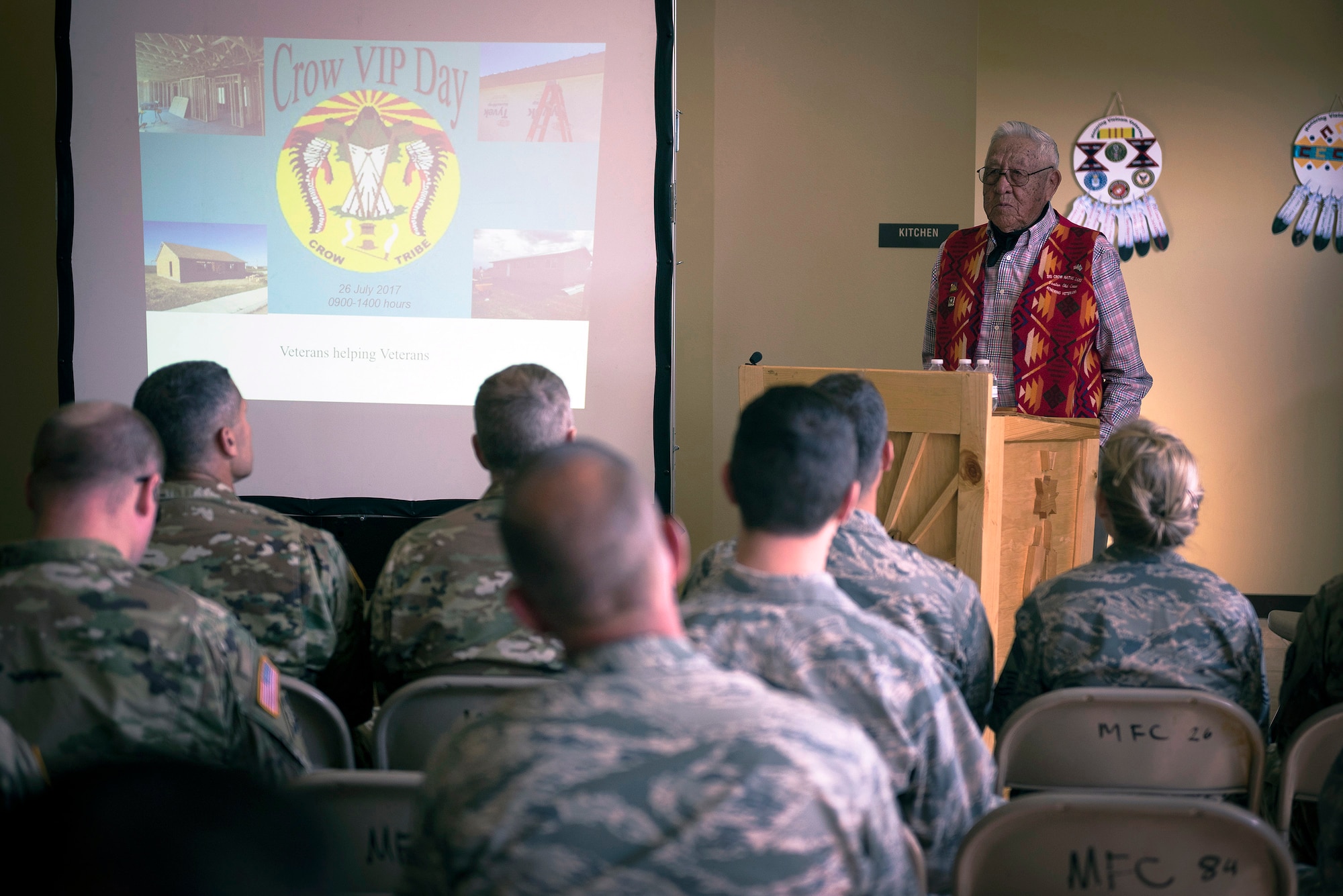 Newton Old Crow, a Crow tribal elder, welcomes military members and fellow Crow citizens to the Innovative Readiness Training program distinguished visitors day in Crow Agency, Mont., July 26, 2017. The IRT program is a civil-military relations cooperative that provided hands-on training for military members who built and renovated homes for Crow military veterans. (U.S. Air National Guard photo by Tech. Sgt. Lealan Buehrer)