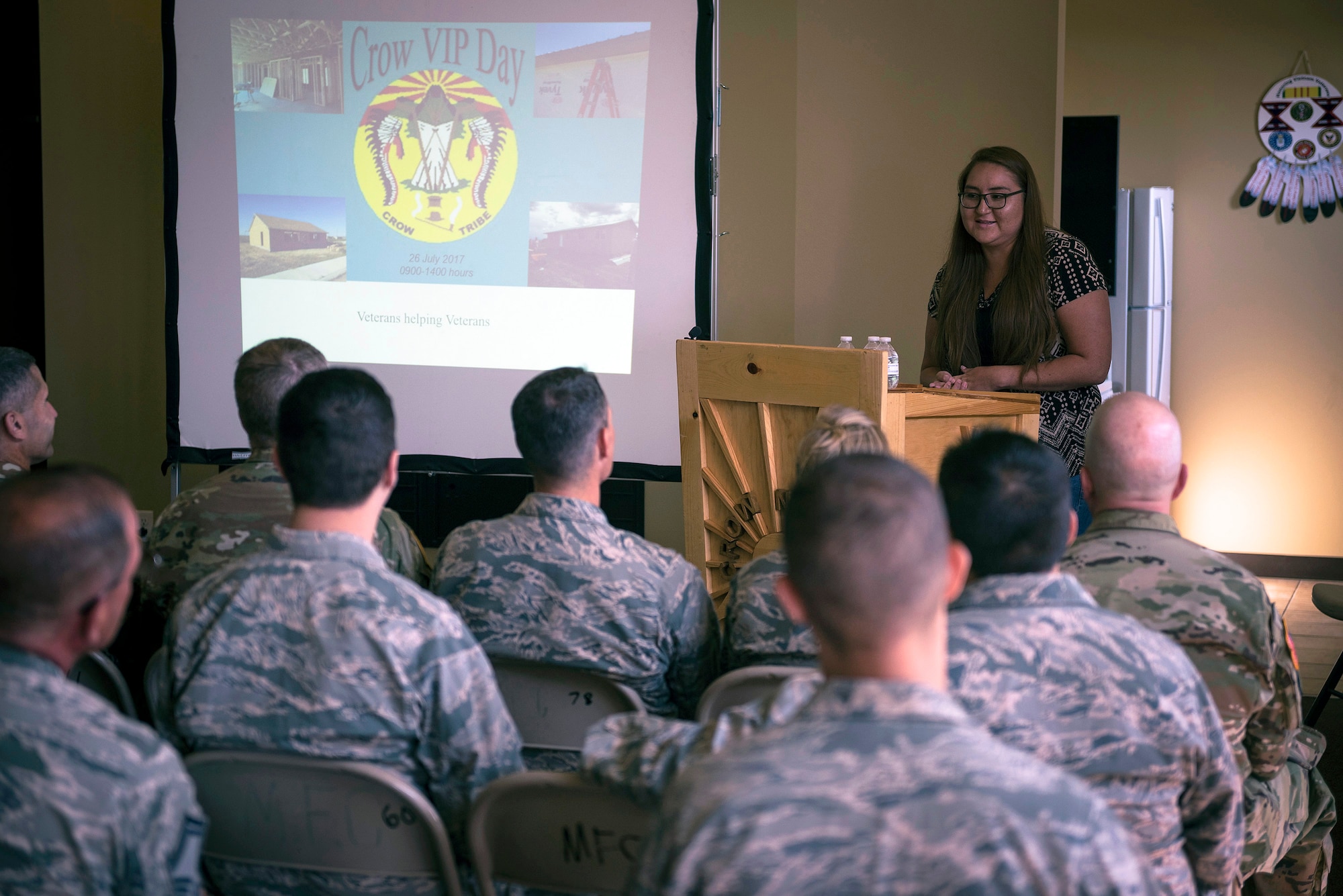 Johnna Snell, a former automated logistical specialist with the U.S. Army Reserve, tells military members and fellow Crow citizens about her experience of having her home renovated through the Innovative Readiness Training program in Crow Agency, Mont., July 26, 2017. The IRT program is a civil-military relations cooperative that provided hands-on training for military members who built and renovated homes for Crow military veterans. (U.S. Air National Guard photo by Tech. Sgt. Lealan Buehrer)