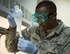 U.S Air Force Staff Sgt. Mario Shanks, non-commission officer in charge of the fuels lab with the 379th Expeditionary Logistics Readiness Squadron, Fuels Management Flight, performs a quality control test at Al Udeid Air Base, Qatar, July 24, 2017. A quality control test is conducted regularly to ensure the fuel going in the aircraft or vehicle meets all standards. (U.S. Air Force photo by Tech. Sgt. Amy M. Lovgren)