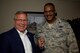 Congressman Mike Bost, representing the 12th district of Illinois, shows off the wing commanders's coin that Col. Esteban Ramirez, commander, 932nd Airlift Wing presented during Bost's visit Aug. 5, 2017, Scott Air Force Base, Illinois.   (U.S. Air Force photo by Tech. Sgt. Christopher Parr)