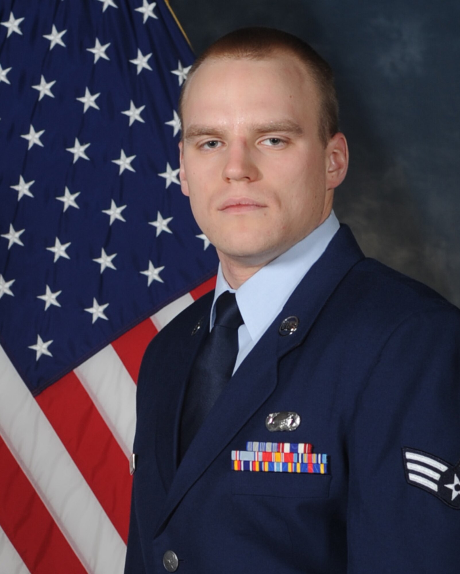 (Then) Senior Airman Dustin Haucke poses for a photo to be used to compete for the National Air and Space Intelligence Center’s annual award. Now a staff sergeant, Haucke was named the Air Force’s Force Support Airman of the Year at the operational level for 2016. (Courtesy photo)
