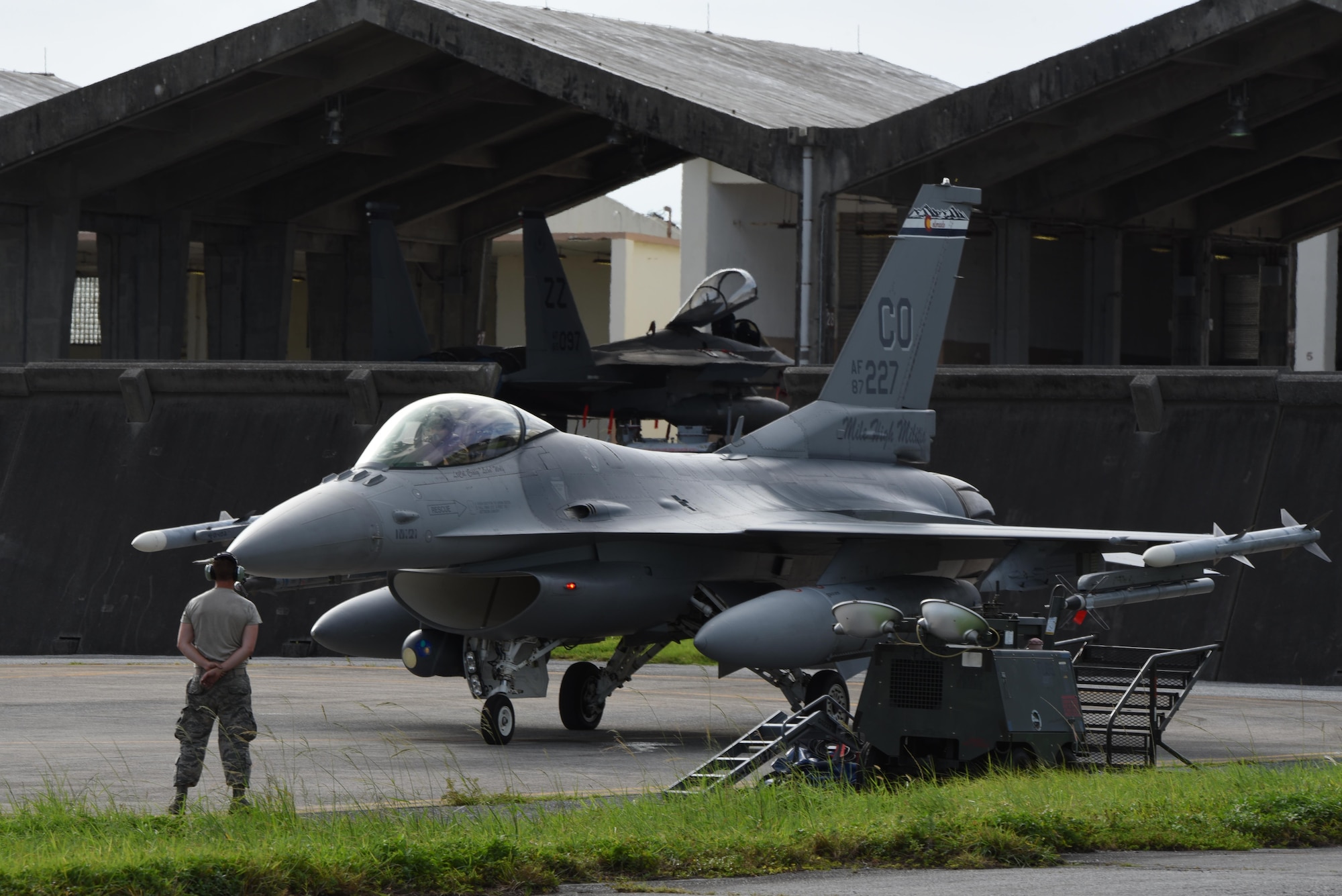 An F-16 aircraft on the flight line preparing to take off.