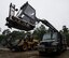 U.S. Air Force Senior Airmen Joey James, left, and Zachary Howlett, right, both 86th Vehicle Readiness Squadron Special Purpose maintenance technicians, time the movements of the boom on a standard deicing truck during the squadron’s Summer Rebuild Program on Ramstein Air Base, Germany, Aug. 10, 2017. The Summer Rebuild Program is from April 1 to Oct. 1, and provides the 86th VRS the time and opportunity to inspect and repair all snow removal vehicles for the upcoming season. (U.S. Air Force photo by Senior Airman Tryphena Mayhugh)
