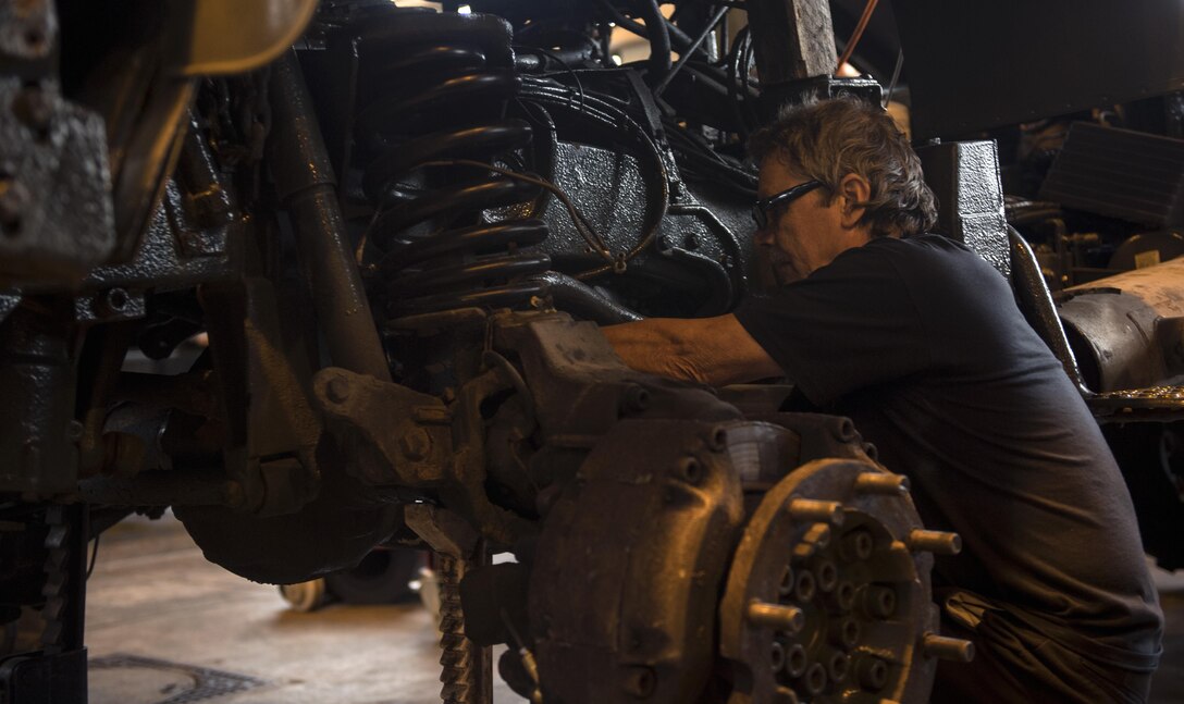 Franz “The Commissioner” Gute, 86th Vehicle Readiness Squadron Special Purpose heavy equipment mechanic, works on a Unimog, a vehicle that spreads salt, during the squadron’s Summer Rebuild Program on Ramstein Air Base, Germany, Aug. 10, 2017. The Summer Rebuild Program will run from April 1 to Oct. 1, during which time the 86th VRS Special Purpose shop will inspect and repair all winter maintenance vehicles on Ramstein in preparation of the upcoming season. (U.S. Air Force photo by Senior Airman Tryphena Mayhugh)