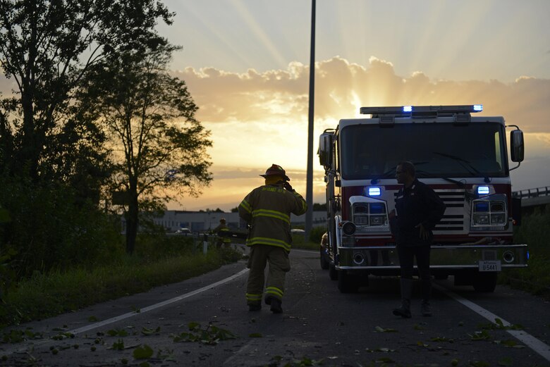 Fabrizio La Marca, 31st Civil Engineer Squadron crew chief, assists in clearing debris off a highway Aug. 10, 2017, in Pordenone Province, Italy. The 31st CES firefighters teamed with local first responders to clear roadways after heavy thunderstorms passed through the area. (U.S. Air Force photo by Tech. Sgt. Andrew Satran)