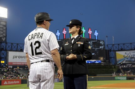 Sgt. Maribel Cano-Meraz, assigned to the 85th Support Command headquartered in Arlington Heights, Illinois, meets Nick Capra, Chicago White Sox third base coach, during the White Sox vs. Houston Astros game ‘Hero of the Game’ military recognition, there, at Guaranteed Rate Field.