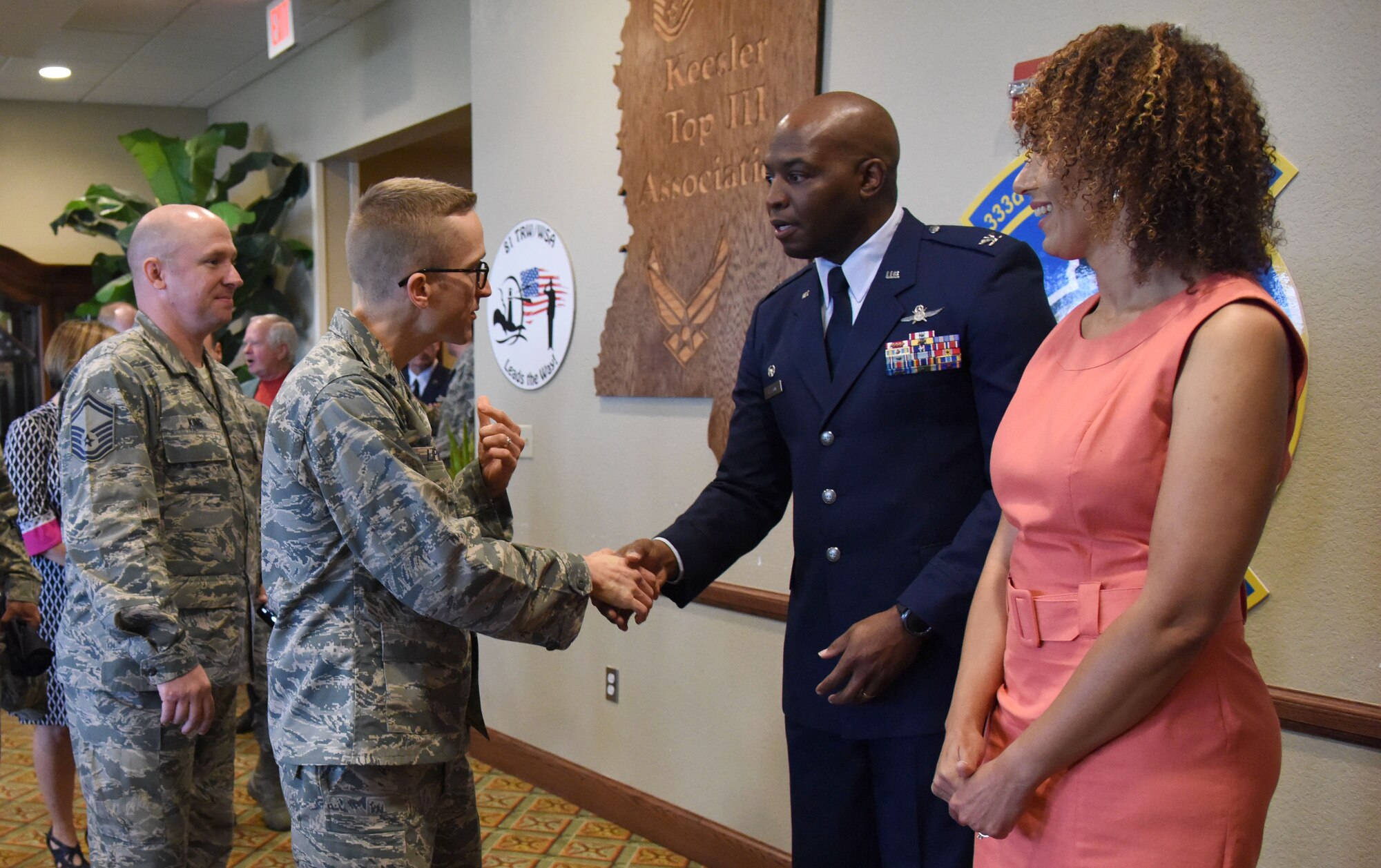 Lt. Col. Steven Lipinski, 335th Training Squadron commander, greets Col. Leo Lawson, Jr., 81st Training Group commander, during a change of command ceremony reception in the Bay Breeze Event Center Aug. 4, 2017, on Keesler Air Force Base, Miss. Lawson assumed command from Col. Scott Solomon. (U.S. Air Force photo by Kemberly Groue)