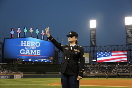 Sgt. Maribel Cano-Meraz, assigned to the 85th Support Command headquartered in Arlington Heights, Illinois, waves to the crowd at the Chicago White Sox vs. Houston Astros game during a ‘Hero of the Game’ military recognition, there, at Guaranteed Rate Field.