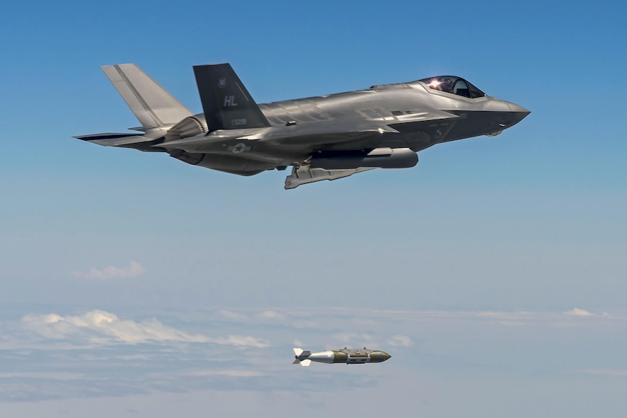 An F-35A Lightning II aircraft from Hill Air Force Base, Utah, drops a 2,000-pound GBU-31 bomb over the Utah Test and Training Range, Aug. 10. The F-35 flew Combat Hammer, an evaluation exercise which tests and validates the performance of crews, pilots, and their technology while deploying precision-guided munitions. (Photo courtesy Scott Wolff)