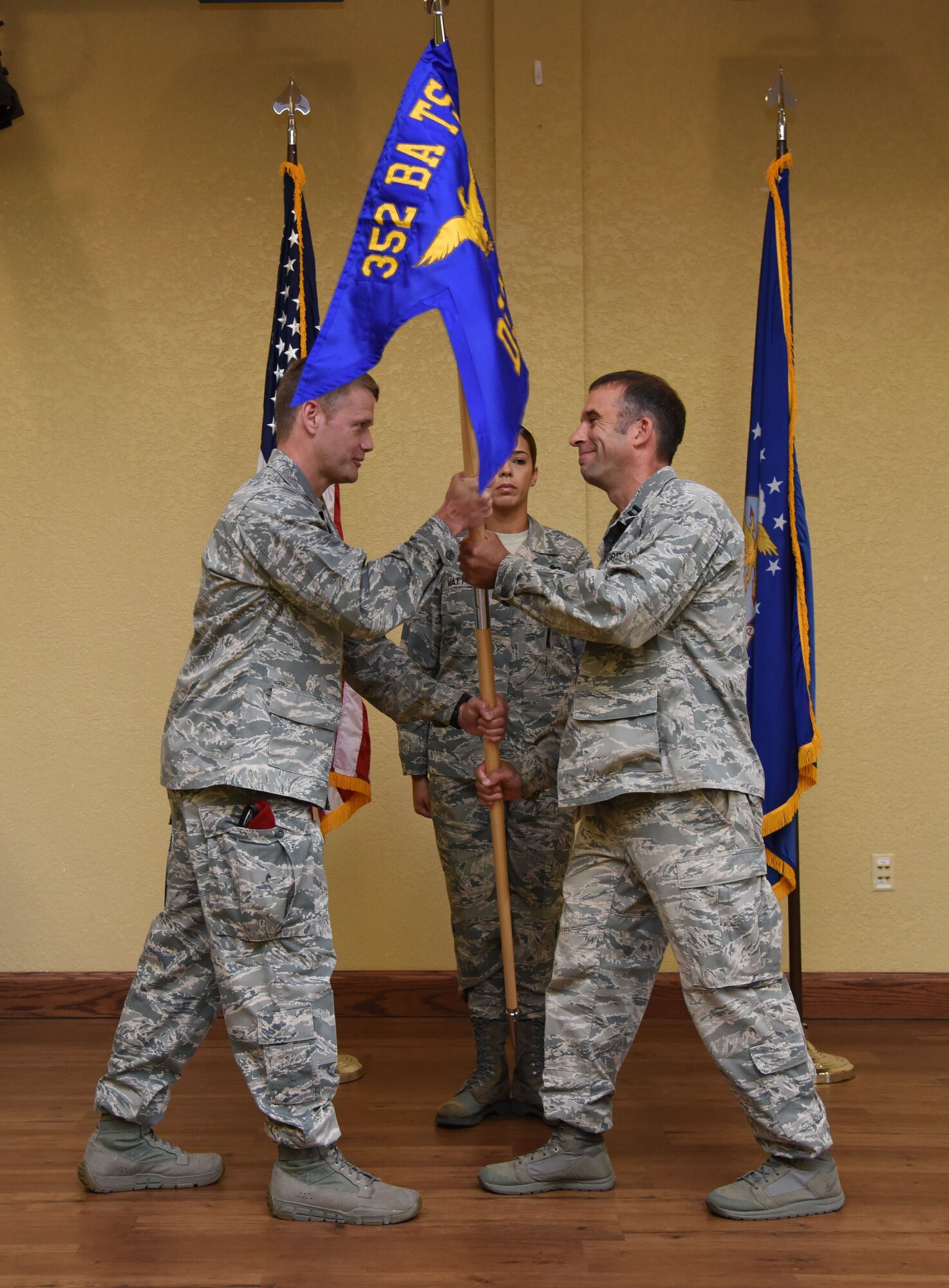 Maj. Trent Joy, 352nd Battlefield Airmen Training Squadron commander, Pope Field, N.C., passes the guidon to Capt. Jesse Sullivan, incoming Detachment 1, 352nd BA TS commander, during the Detachment 1, 352nd BA TS Activation Ceremony in the Bay Breeze Event Center Aug. 2, 2017, on Keesler Air Force Base, Miss. Sullivan assumed command of the squadron, which provides the Department of Defense, Air Force Special Operations Command and the 24th Special Operations Wing with mission ready Combat Controllers and Special Operations Weathermen. (U.S. Air Force photo by Kemberly Groue)