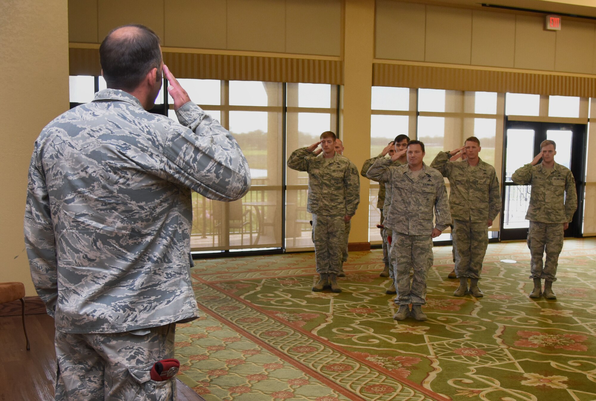 Capt. Jesse Sullivan, Detachment 1, 352nd Battlefield Airmen Training Squadron commander, returns a salute to squadron members during the Detachment 1, 352nd BA TS Activation Ceremony in the Bay Breeze Event Center Aug. 2, 2017, on Keesler Air Force Base, Miss. Sullivan assumed command of the squadron, which provides the Department of Defense, Air Force Special Operations Command and the 24th Special Operations Wing with mission ready Combat Controllers and Special Operations Weathermen. (U.S. Air Force photo by Kemberly Groue)