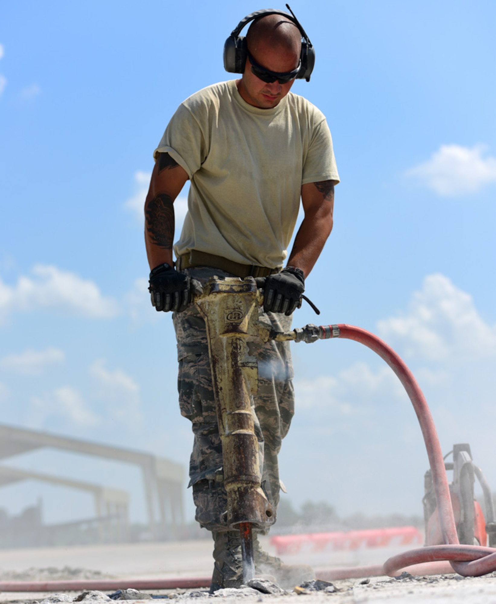 U.S. Air Force Staff Sgt. Warocz, a 509th Civil Engineer Squadron pavement and equipment shop supervisor, uses a jack hammer at Whiteman Air Force Base, Mo., July 25, 2017. Members of the shop, known as “Dirtboyz,” refurbished 19 yards of concrete on the flightline, enabling taxiway K to be operational again.