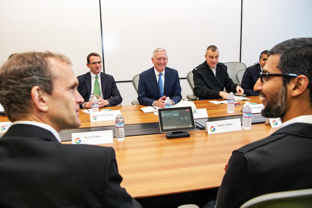 Defense Secretary Jim Mattis meets with a group of people around a table.