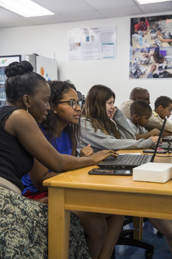 Students in the Maker Space Lab receive assistance on troubleshooting from instructors at the Shadow Mountain Branch Library aboard the Marine Corps Air Ground Combat Center, Twentynine Palms, Calif., August 9, 2017. The library conducted the lab to foster excitement about the future of technology in children from military parents and open their minds to positive opportunities. (U.S. Marine Corps photo by Pfc. Margaret Gale)