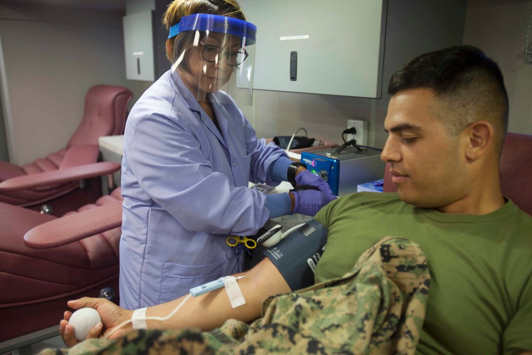 Lance Cpl. Alexander Roldan, a clerk with Marine Aircraft Logistics Squadron (MALS) 11, donates blood during a blood drive at Marine Corps Air Station Miramar, Calif., Aug. 10. The Armed Services Blood Program (ASBP) is the official military blood program of the United States and directly supports military service members and their families. (U.S. Marine Corps photo by Sgt. Shakima Deprince/Released)