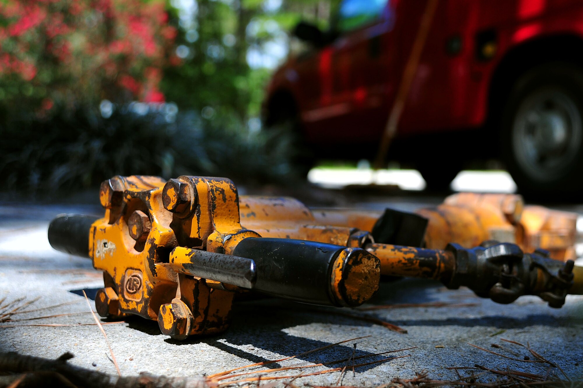 U.S. Airmen assigned to the 20th Civil Engineer Squadron worked as a team to demolish an uneven concrete sidewalk upheaved by tree roots at Shaw Air Force Base, S.C., Aug. 10, 2017. The pavement and construction equipment Airmen,  also known as “Dirt Boyz,” used tools such as a pneumatic 30-pound jack hammer and pickaxe to remove approximately five cubic yards of concrete to make way for a new path. (U.S. Air Force photos by Airman 1st Class Kathryn R.C. Reaves)