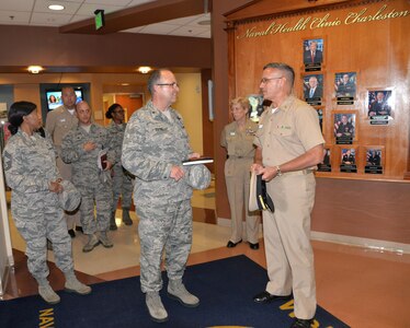 Naval Health Clinic Charleston Commanding Officer Capt. Dale Barrette, right, highlights the services available at NHCC with Air Force Brig. Gen. Lee Payne, Air Mobility Command Surgeon, center, and Chief Master Sgt. Sonya
Stoute, left, AMC Medical Enlisted Force Chief, as they tour NHCC during their visit to Joint Base Charleston July 25.