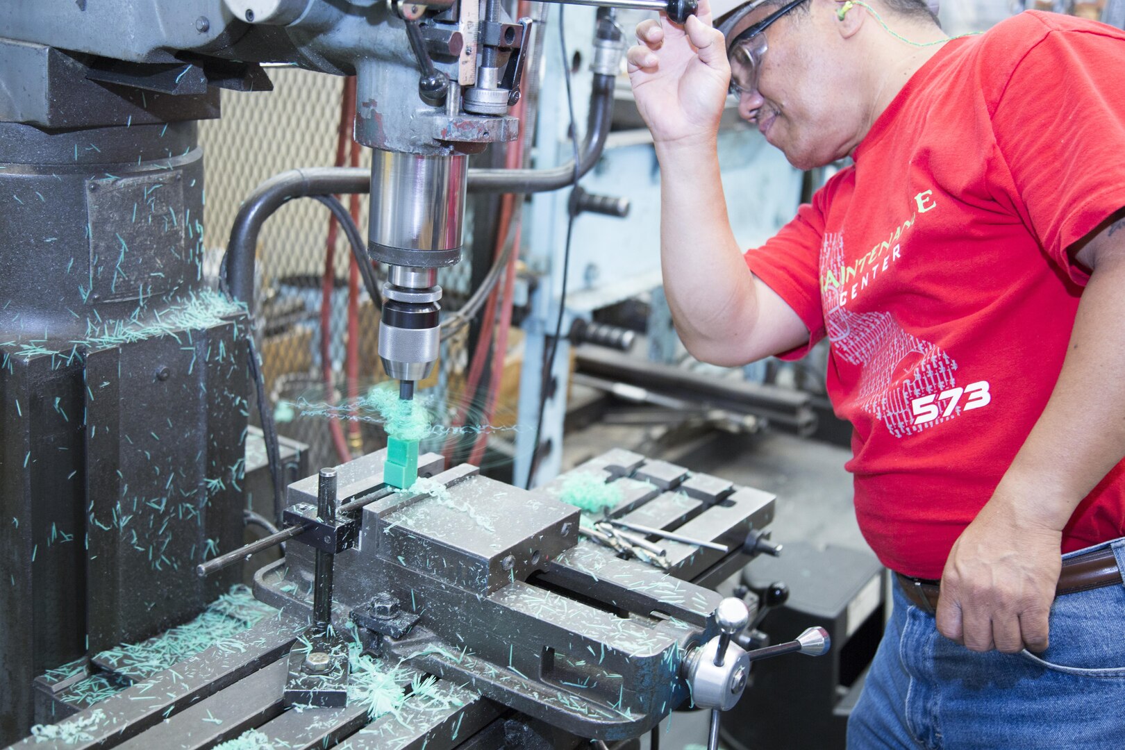 Wilfredo Dizon brings his more than 30 years experience as a machinist both in the Navy and civilian life to Production Plant Barstow. Here he is boring out a hole in a plastic part using a vertical milling machine, Aug. 2. Dizon said working on plastic is harder than working on metal at the Marine Depot Maintenance Command facility board the Yermo Annex of Marine Corps Logistics Base Barstow, Calif.