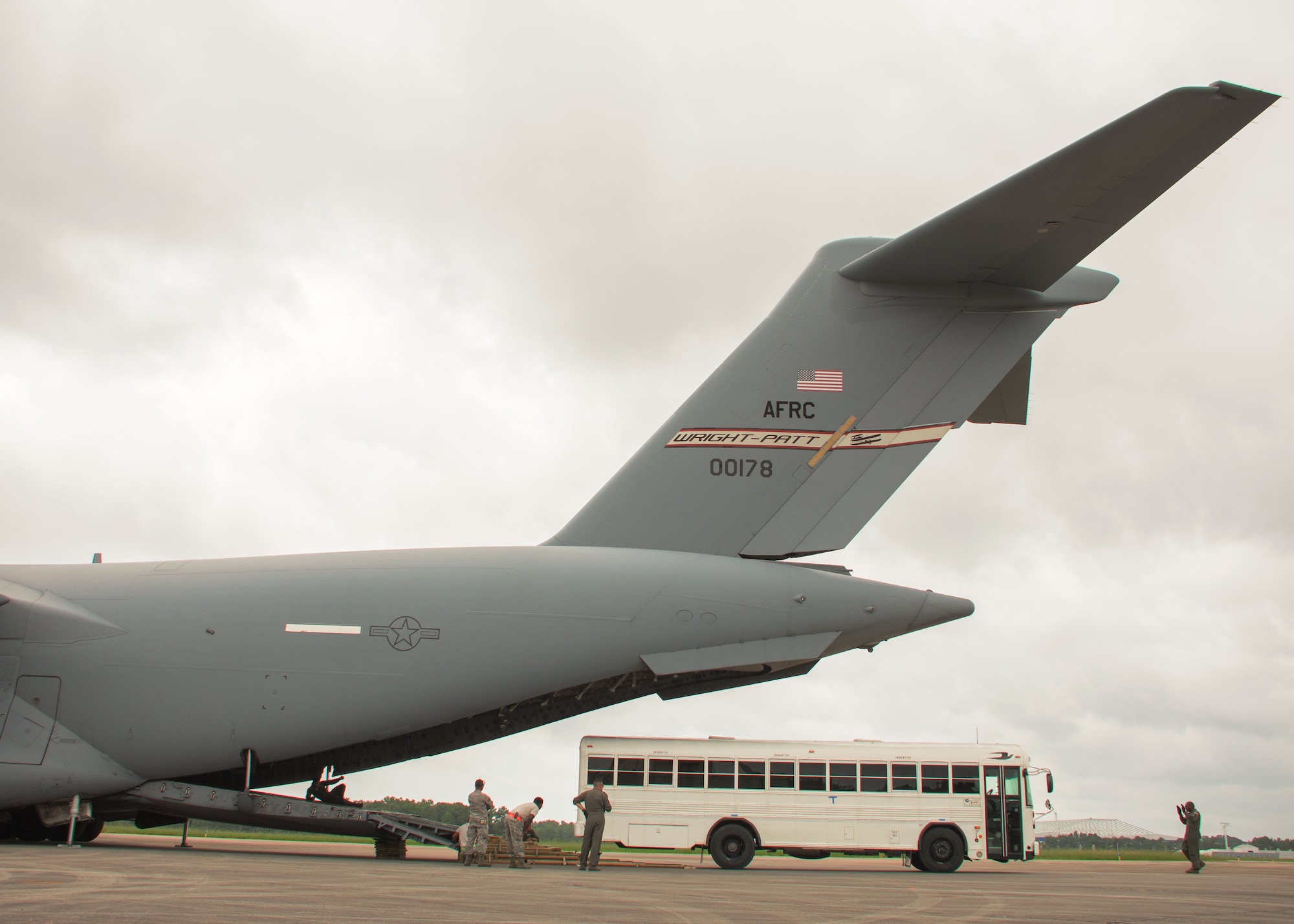 Aerial porters with the Patriot Warrior Exercise load a bus onto the back of a C-17 Globemaster III at Dobbins Air Reserve Base, Ga. Aug. 7, 2017. Aerial porters loaded a variety of items including equipment, cargo and personnel required to support the fight at the simulated frontlines of the exercise. (U.S. Air Force photo/Staff Sgt. Andrew Park)