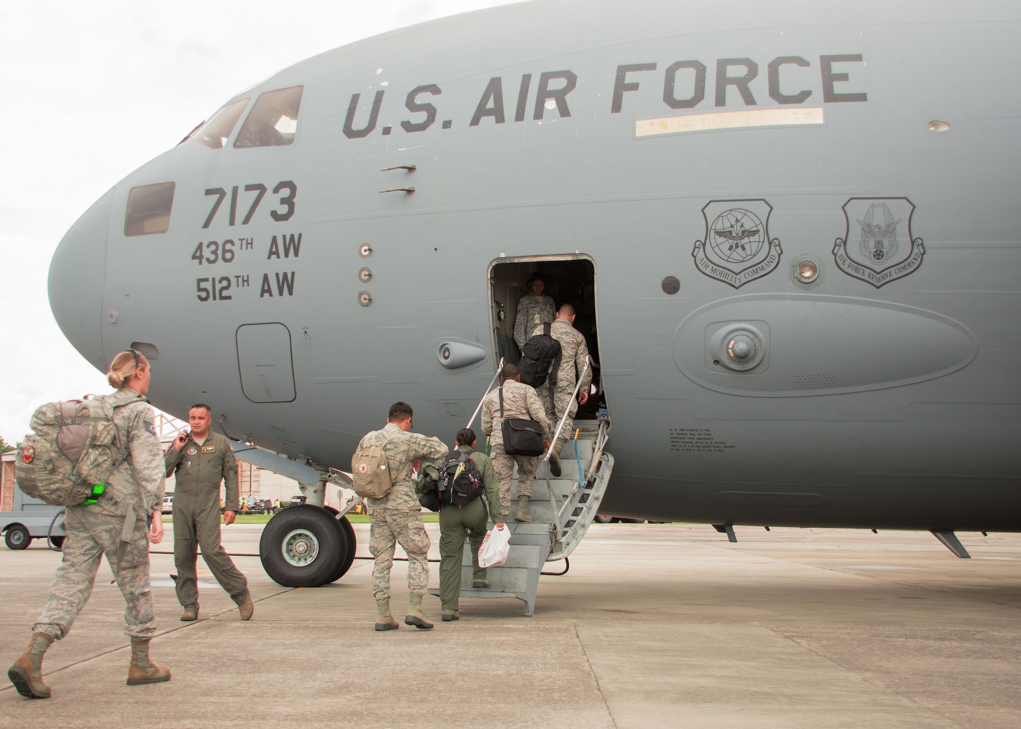 Airmen participating in the Patriot Warrior Exercise board a C-17 Globemaster III at Dobbins Air Reserve Base, Ga. on Aug. 10, 2017. The Expeditionary Logistics Readiness Flight here for the exercise processed more than 400 deployers arriving from units around Air Force Reserve Command.  (U.S. Air Force photo/Staff Sgt. Andrew Park)