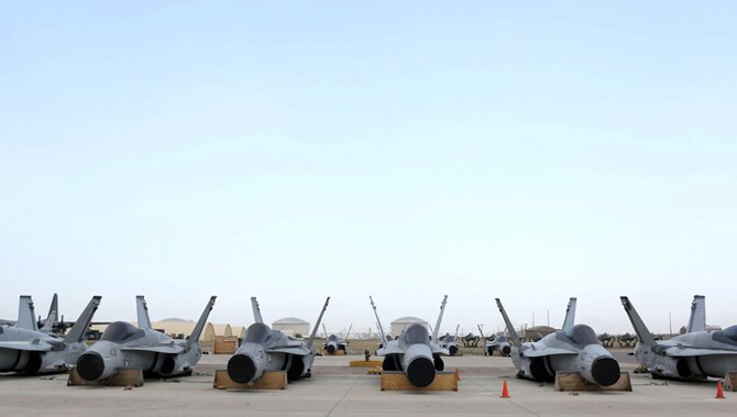 Six F/A-18C Hornets sit on the ramp at the 309th Aircraft Maintenance and Regneration Group at Davis-Monthan AFB, Ariz., in preparation for transport to Boeing’s maintenance facility at Cecil Airport in Jacksonville, Fla. (U.S. Air Force photo/Teresa Pittman)
