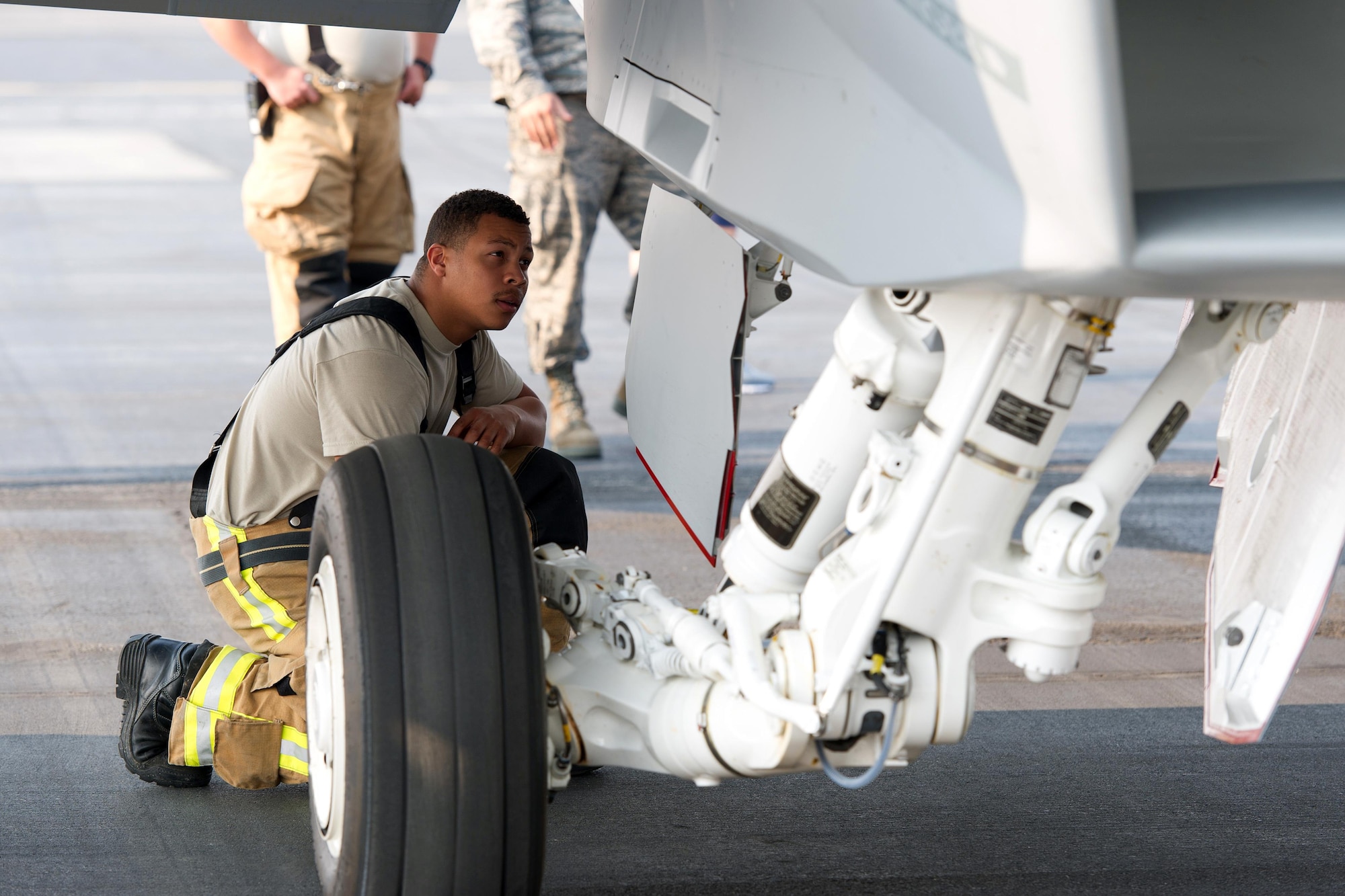 inspecting a U.S. Navy F-18 Super Hornet