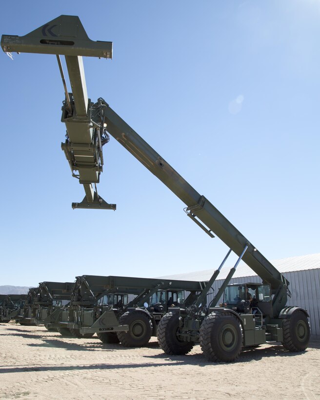 Marines from 4th Marine Logistics Group, Marine Forces Reserve, from reserve units all over the country, prepare, test and inpsect Kalmar RT240 heavy equipment, international shipping container transporters on the Yermo Annex aboard Marine Corps Logistics Base Barstow, Calif., Aug. 9. The equipment can lift and stack in yards, on ships, trucks, railcars, in any location Marines are located. They are designed to move 20-40 foot shipping containers and have the capacity to lift up to 53,000 poinds.